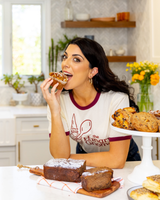 Founder and chef Danielle Sepsy eating a scone